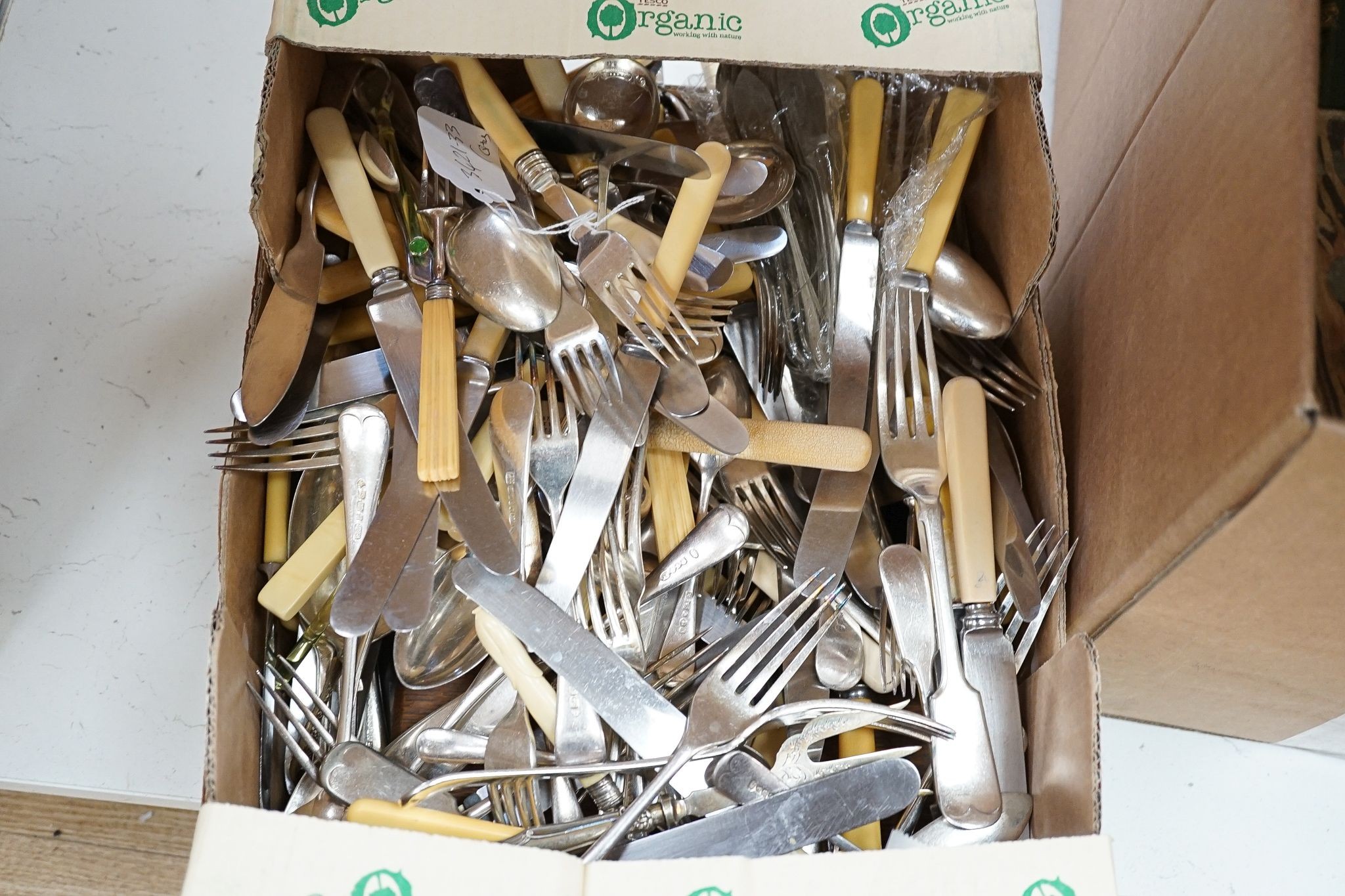 A large quantity of assorted plated cutlery, including fish knives and forks and servers and three cased sets.